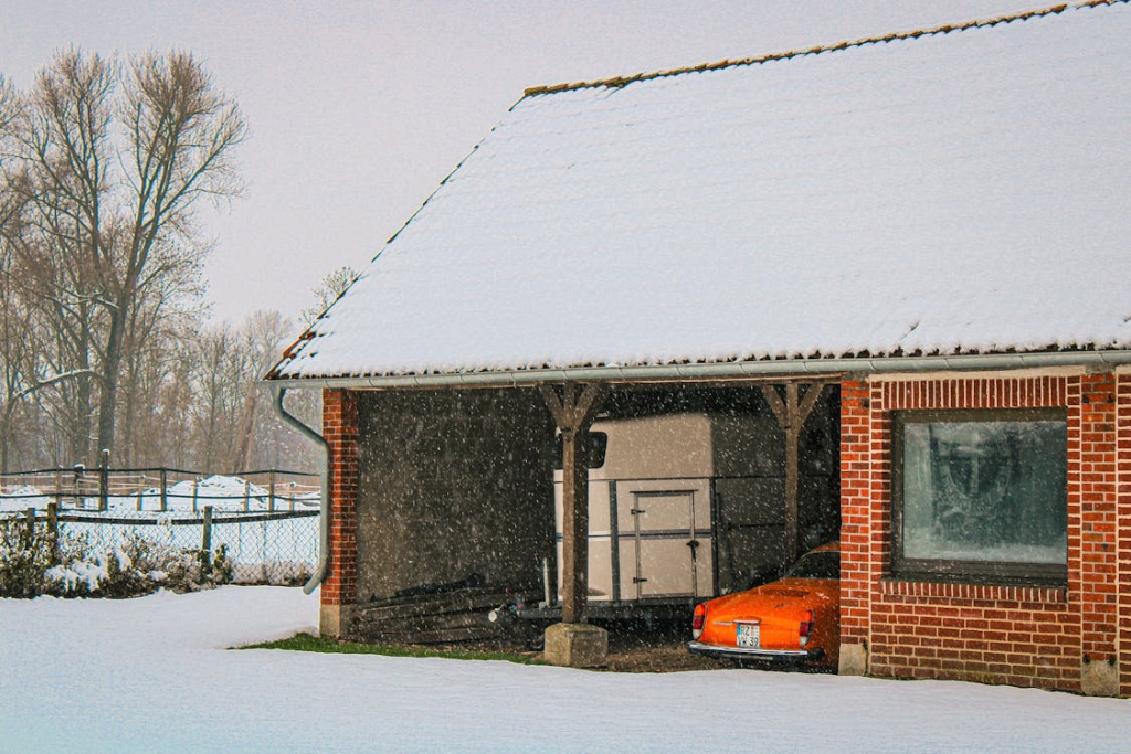 Stuck garage door with ice and snow buildup around it