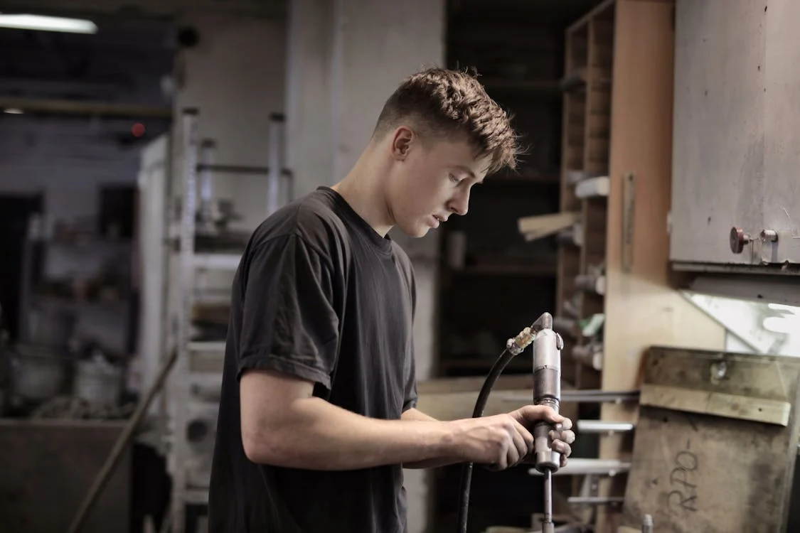 A technician tuning up a garage door